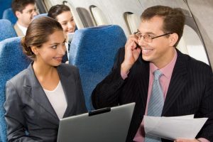 online travel consultant - laptop in aircraft cabin